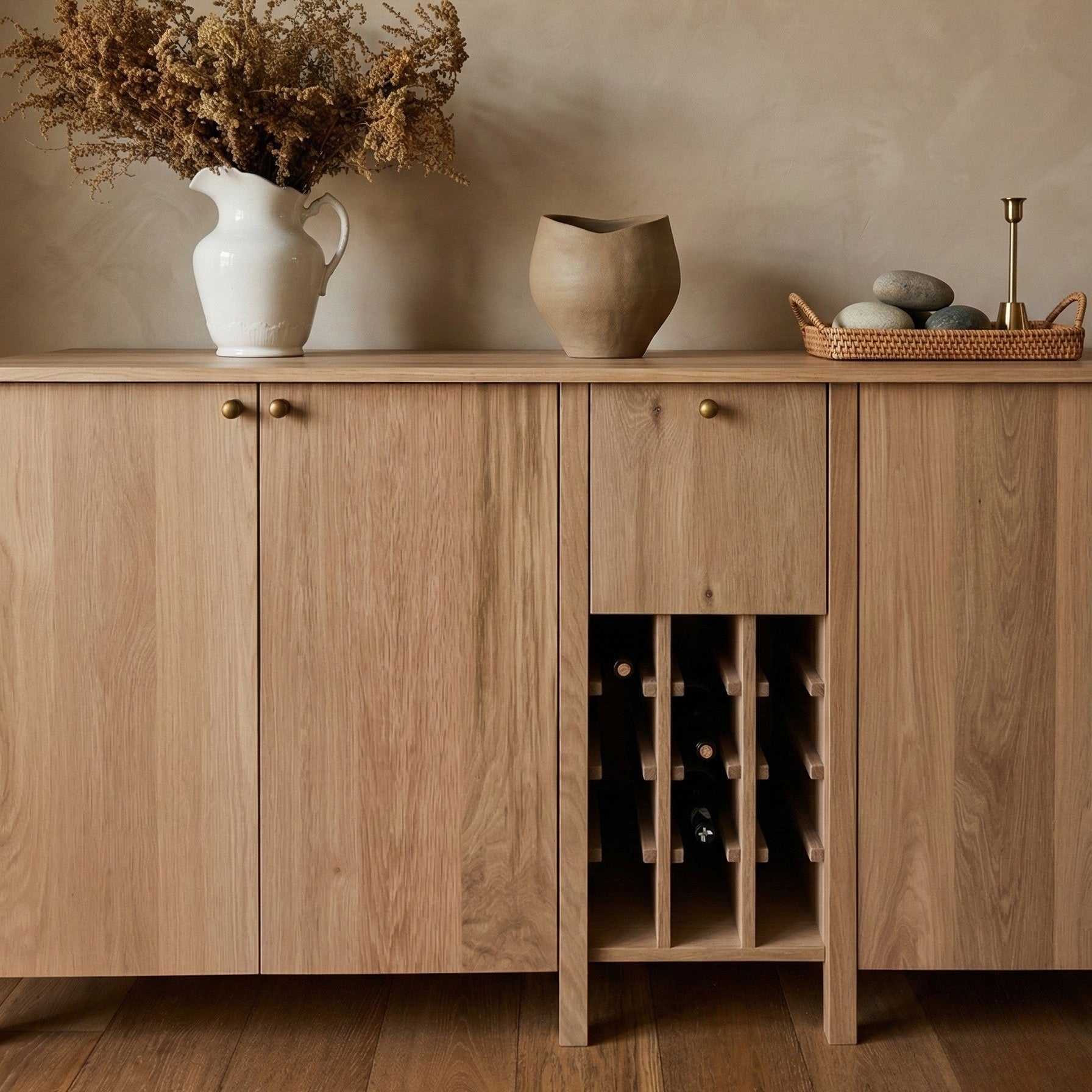 Wooden sideboard with decorative items against a beige wall